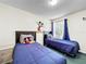 Bright bedroom featuring twin beds, a playful Mickey Mouse theme, and natural light from the window at 2040 Royal Bay Blvd # 30, Kissimmee, FL 34746