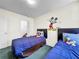 Bright bedroom featuring twin beds and a playful Mickey Mouse theme at 2040 Royal Bay Blvd # 30, Kissimmee, FL 34746