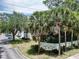Royal Palm Bay community sign surrounded by lush palm trees and greenery at 2040 Royal Bay Blvd # 30, Kissimmee, FL 34746