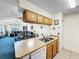 Kitchen view showcasing an open floor plan, cabinetry, and seamless flow to living area at 2040 Royal Bay Blvd # 30, Kissimmee, FL 34746