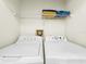 Clean laundry room with a side-by-side washer and dryer and shelving at 2040 Royal Bay Blvd # 30, Kissimmee, FL 34746