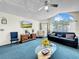 Bright living room featuring a large arched window, ceiling fan, vaulted ceiling, and sofa at 2040 Royal Bay Blvd # 30, Kissimmee, FL 34746