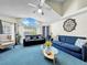 Bright living room featuring a large arched window, ceiling fan, vaulted ceiling, and sofa at 2040 Royal Bay Blvd # 30, Kissimmee, FL 34746