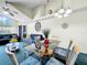 Open-concept living and dining area with vaulted ceilings, lots of light, and ceiling fan at 2040 Royal Bay Blvd # 30, Kissimmee, FL 34746
