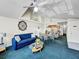 Open-concept living and dining area with vaulted ceilings, lots of light, and ceiling fan at 2040 Royal Bay Blvd # 30, Kissimmee, FL 34746