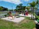 Playground featuring slides and climbing equipment near the tennis court provides a vibrant recreational space at 2040 Royal Bay Blvd # 30, Kissimmee, FL 34746