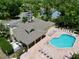 Aerial view of clubhouse, pool, and lounge area with plenty of seating near the parking lot at 2040 Royal Bay Blvd # 30, Kissimmee, FL 34746