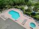 Aerial view of the community pool with plenty of lounge seating and tables to enjoy a relaxing day in the sun at 2040 Royal Bay Blvd # 30, Kissimmee, FL 34746