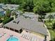 Aerial view of clubhouse, pool, and lounge area with plenty of seating near the parking lot and pond at 2040 Royal Bay Blvd # 30, Kissimmee, FL 34746