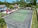A complex with tennis courts and basketball hoops, a playground, and a beach volleyball court for lots of fun at 2040 Royal Bay Blvd # 30, Kissimmee, FL 34746