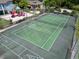 Tennis and shuffleboard court, with nearby playground and clubhouse offer diverse leisure activities for the community at 2040 Royal Bay Blvd # 30, Kissimmee, FL 34746