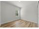 This bedroom features a window for natural light and modern flooring at 2415 Sw 165Th Pl, Ocala, FL 34473