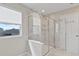 Bathroom featuring a glass enclosed shower with marble tile surround at 2546 Empress Dr, Kissimmee, FL 34741