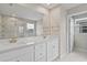 Bright bathroom featuring dual vanity, granite counters, and a glass enclosed shower at 2546 Empress Dr, Kissimmee, FL 34741