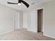 Bedroom featuring neutral walls, carpet flooring, ceiling fan and closet at 2546 Empress Dr, Kissimmee, FL 34741