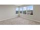 Bedroom with carpet and multiple windows, providing plenty of natural light at 2546 Empress Dr, Kissimmee, FL 34741