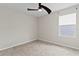 Neutral bedroom featuring carpet flooring, a ceiling fan, and a window at 2546 Empress Dr, Kissimmee, FL 34741