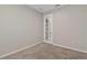 Neutral bedroom featuring carpet flooring and a door to a walk-in closet at 2546 Empress Dr, Kissimmee, FL 34741