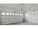 Spacious garage with overhead storage racks and an automatic garage door opener at 2546 Empress Dr, Kissimmee, FL 34741