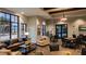 Community lounge area with comfortable seating, tables, modern decor, and ample natural light at 2546 Empress Dr, Kissimmee, FL 34741