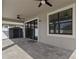 Covered patio features ceiling fans, brick pavers, and a view of the backyard and storage shed at 2546 Empress Dr, Kissimmee, FL 34741