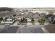 Street view of modern two-story homes with well-maintained lawns and brick driveways near a pond at 2546 Empress Dr, Kissimmee, FL 34741