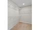 Walk-in closet featuring carpet flooring and wire shelving at 2546 Empress Dr, Kissimmee, FL 34741