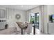 Dining room with modern decor, stylish table setting, and sliding door access to the backyard at 2610 Grandbury Grove Rd, Lakeland, FL 33811