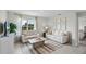 Cozy living room featuring neutral sofas, a patterned rug, and a bright window view at 2610 Grandbury Grove Rd, Lakeland, FL 33811