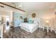 Bright bedroom with wood beam, white bedding, and side table at 2621 Talon Ct, Orlando, FL 32837