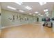 Community dance studio with hardwood floors, mirrored wall, and ballet barre at 27307 Pine Straw Rd, Leesburg, FL 34748
