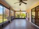 Screened lanai with ceiling fans offers a relaxing outdoor space at 27307 Pine Straw Rd, Leesburg, FL 34748