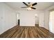 This bedroom boasts wood-look floors and an ensuite bathroom and walk-in closet at 3057 Aaron Burr Ave # 1, Winter Park, FL 32792