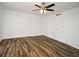 Bright bedroom features wood-look floors, a ceiling fan, and freshly painted white walls at 3057 Aaron Burr Ave # 1, Winter Park, FL 32792