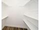 Walk-in closet with built-in shelving at 3057 Aaron Burr Ave # 1, Winter Park, FL 32792