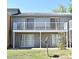Two-story building featuring sliding glass doors and white balconies on both the first and second floors at 3057 Aaron Burr Ave # 1, Winter Park, FL 32792