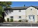 Charming two-story condo with light blue shutters and well-maintained landscaping in a well-lit parking area at 3057 Aaron Burr Ave # 1, Winter Park, FL 32792