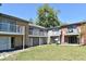 View of the exterior of the apartments, which have balconies that overlook a green lawn at 3057 Aaron Burr Ave # 1, Winter Park, FL 32792