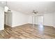 Bright and airy living room with modern wood-style tile flooring and sliding glass doors at 3057 Aaron Burr Ave # 1, Winter Park, FL 32792