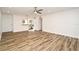 Open-concept living room featuring tile floors and a view into the kitchen with stainless steel appliances at 3057 Aaron Burr Ave # 1, Winter Park, FL 32792