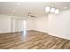 Spacious living room with wood-look flooring, ceiling fan, and sliding glass doors at 3057 Aaron Burr Ave # 1, Winter Park, FL 32792