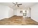 Open-concept living room featuring tile floors and a view into the kitchen with stainless steel appliances at 3057 Aaron Burr Ave # 1, Winter Park, FL 32792