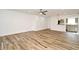 Bright living room featuring wood-style tile floors, recessed lighting and neutral paint at 3057 Aaron Burr Ave # 1, Winter Park, FL 32792