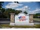 Entrance sign to the The Colonies community, with a waving American Flag on the sign at 3057 Aaron Burr Ave # 1, Winter Park, FL 32792