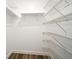 Interior view of walk-in closet with adjustable shelving and lighting at 3057 Aaron Burr Ave # 1, Winter Park, FL 32792