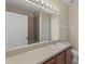 Bathroom showcasing a sink, vanity, mirror and bathtub at 326 Cotswold Cir, Davenport, FL 33837
