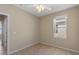 Room showcasing a window, tiled floor and a ceiling fan at 326 Cotswold Cir, Davenport, FL 33837