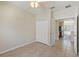 A bright bedroom with a double door closet and easy access to the kitchen at 326 Cotswold Cir, Davenport, FL 33837