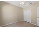 View of a bedroom featuring a closet, a window, and a ceiling fan at 326 Cotswold Cir, Davenport, FL 33837