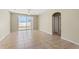 Spacious living room with tile flooring, a ceiling fan, and access to the backyard at 326 Cotswold Cir, Davenport, FL 33837